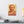 Canvas wall art with a bold orange and yellow Illustration of Greek historian Herodotus on a white wall above a modern desk