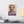 Canvas wall art with a bold purple and beige Illustration of Greek statesman Pericles on a white wall above a desk