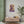 Bold purple and beige illustration of Greek statesman Pericles on a fine art poster on wall in a modern interior room