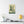 Canvas wall art with a bold green and beige illustration of ancient Greek philosopher Socrates on a white wall above a desk