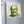 Fridge magnet with a bold green and beige illustration of ancient Greek philosopher Socrates on a refrigerator