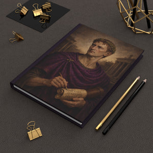 Hardcover journal with a beautiful, original illustration of Roman emperor Augustus on a dark surface with writing utensils