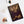 Spiral notebook with an original, beautiful illustration of Roman emperor Augustus placed on a white surface with a clip and photo in the background.