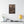 Canvas wall art with a beautiful, original illustration of Roman emperor Aurelian on a wall above a shelf with decor items.