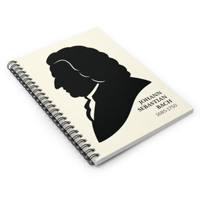 Spiral notebook with a black on ivory silhouette illustration of musician Johann Sebastian Bach lying flat on a white surface