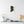 Canvas wall art with a black on ivory silhouette illustration of musician Ludwig van Beethoven on a wall above a table with decor items.