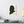 Canvas wall art with a black on ivory silhouette illustration of musician Johannes Brahms on a wall above a desk with books and a lamp.