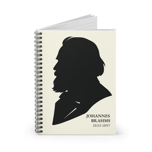 Spiral notebook with a black on ivory silhouette illustration of musician Johannes Brahms opened