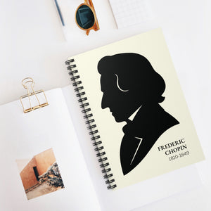 Spiral notebook with a black on ivory silhouette illustration of musician Frederic Chopin on a white surface