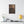 Canvas wall art with a beautiful, original illustration of Roman emperor Constantine on a wall above a shelf with decor items.
