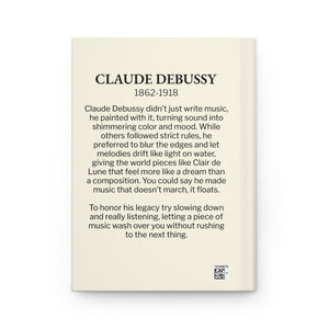 Hardcover journal with a black-on-ivory silhouette illustration of musician Claude Debussy with a bio on the back cover