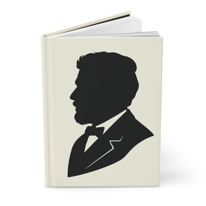Hardcover journal with a black-on-ivory silhouette illustration of musician Claude Debussy opened