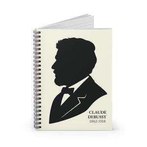 Spiral notebook with a black on ivory silhouette illustration of musician Claude Debussy opened
