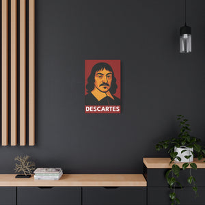 Canvas wall art with a bold illustration of mathematician and philosopher Rene Descartes on a dark wall with a wooden shelf and plant in the foreground