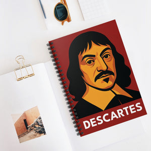 Spiral notebook with a bold illustration of mathematician and philosopher Rene Descartes on a white surface with papers