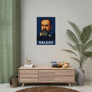 Fine art poster with a bold illustration of astronomer Galileo Galilei on a wall above a wooden cabinet with decorative items.