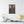 Canvas wall art with a beautiful, original illustration of Roman emperor Hadrian on a wall above a table with decor items.