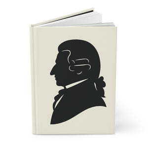Hardcover journal with a black on ivory silhouette illustration of musician Joseph Haydn opened view