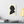 Canvas wall art with a black on ivory silhouette illustration of musician Franz Liszt on a wall above a desk with books and a lamp.