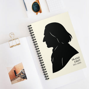 Spiral notebook with a black on ivory silhouette illustration of musician Franz Liszt on a white surface