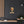 Canvas wall art with a bold illustration of philosopher John Locke on a dark wall with a modern interior setting