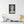 Canvas wall art with a bold illustration of Roman empress Messalina on a wall above a shelf with decor items.
