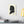 Canvas wall art with a black on ivory silhouette illustration of musician Wolfgang Amadeus Mozart on a wall above a desk.