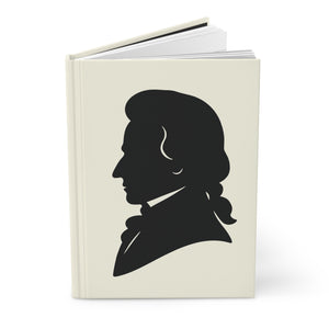 Hardcover journal with a black on ivory silhouette illustration of musician Wolfgang Amadeus Mozart opened
