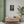Fine art poster with a bold illustration of scientist Isaac Newton on a wall in room interior