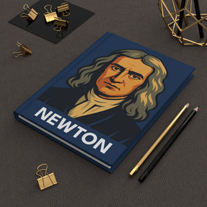 Hardcover journal with a bold illustration of scientist Isaac Newton on a dark surface with office supplies