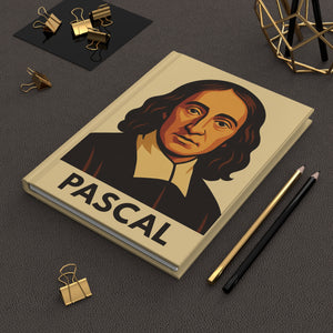Hardcover journal with a bold illustration of mathematician and philosopher Blaise Pascal on a dark surface with office supplies.
