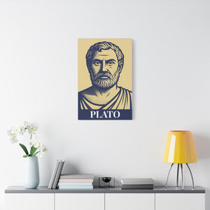 Canvas wall art with a bold illustration of ancient Greek philosopher Plato on a wall above a table with a lamp and books.