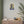Fine art poster with a bold illustration of ancient Greek philosopher Plato on a wall above a cabinet

