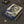 Hardcover journal with a bold illustration of ancient Greek philosopher Plato
on a dark surface with office supplies.