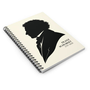Spiral notebook with a black-on-ivory silhouette illustration of musician composer Franz Schubert flat on a white surface