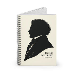 Spiral notebook with a black-on-ivory silhouette illustration of musician composer Franz Schubert opened