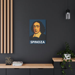Canvas wall art with a bold illustration of philosopher Baruch Spinoza on a dark wall with a wooden shelf and plant in the foreground