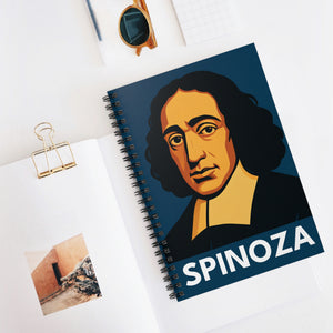 Spiral notebook with a bold illustration of philosopher Baruch Spinoza on a white surface with a photo and glasses