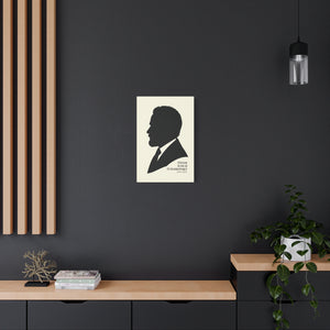 Canvas wall art with a black on ivory silhouette illustration of musician Pyotr Ilyich Tchaikovsky on a dark wall with wooden shelves and decor.