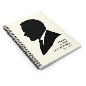 Spiral notebook with a black on ivory silhouette illustration of musician Pyotr Ilyich Tchaikovsky lying flat on a white surface