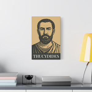 Canvas wall art with a bold black and beige illustration of ancient Greek historian Thucydides on a white wall above a desk