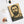 Spiral notebook with a bold black and beige illustration of ancient Greek historian Thucydides lying flat on a white surface with other items for context