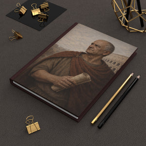Hardcover journal with a beautiful, original illustration of Roman emperor Vespasian on a dark surface with office supplies.